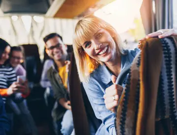 Happy passengers traveling by bus.