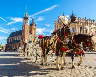 Horse carriages at main square in Krakow in a summer day, Poland