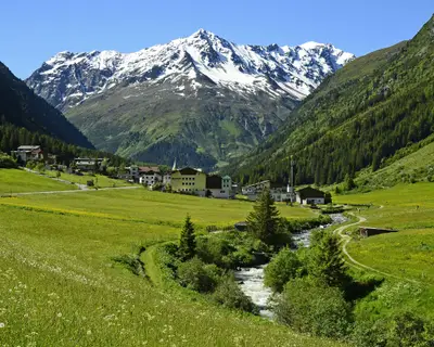 Plangeross, Austria - June 23rd 2016: Tiny village in Pitztal with snowy Tyrolean alps in background, preferred area for skiing and hiking