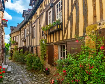 old cozy street with historic half timbered buildings in the the beautiful town of Honfleur, France with nobody
