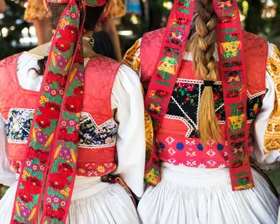 Anonymous girls in folklore costumes, back detail